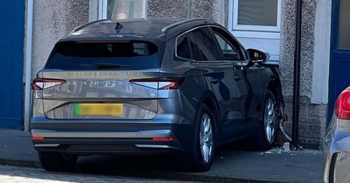 Car ploughs into flats as locals evacuated from homes over gas leak fears