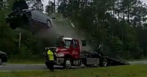 Terrifying video shows car launching off tow truck on highway in horror crash