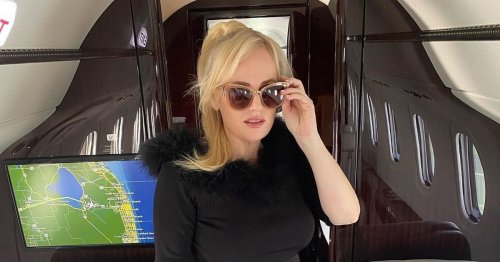 Rebel Wilson looks sensational as she flaunts tiny waist in tight biker shorts