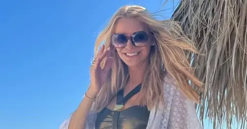 Tess Daly shows off killer figure in sexy gold swimsuit for rare holiday snap