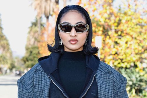 Shenseea Stands Out In Trench Coat, Fishnet Leggings At Balenciaga’s Pre-Fall 2024 Show