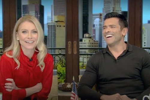 Kelly Ripa Remembers Wanting To Sleuth After Mark Consuelos Was “AirDropped A Bunch Of Illicit Things” On The Plane On ‘Live’: “He Wanted Nothing To Do With It, And I Wanted Everything To Do With It!”