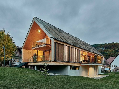 Spacious Wooden Home with Gabled roof in Wood, Concrete and Glass