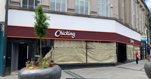 Activity inside prominent city building as worldwide fast food restaurant set to open