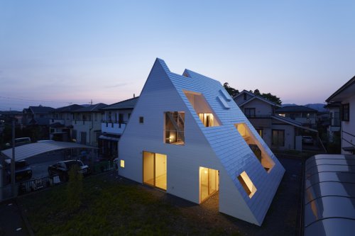 A White A-Frame House in Japan With Strategically Placed Openings