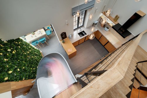 A Childhood Fantasy Comes True: An Apartment with a Slide