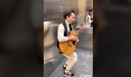 Imagine The Elevator Door Opens And You See This Guy Covering Black Sabbath On An Acoustic Guitar