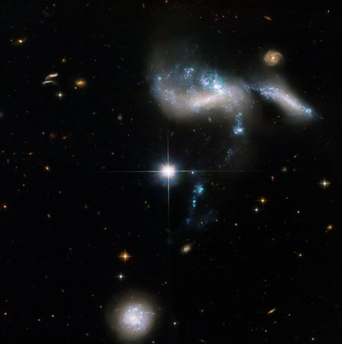 See four dwarf galaxies merging into one in this Hubble image
