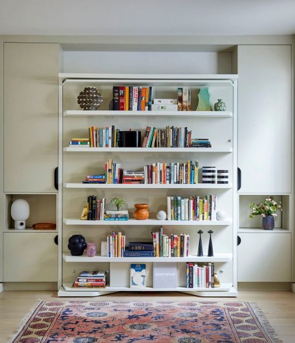 With a Light Push and Pull, the Built-In in This Basement Goes From Bookshelf to Bed