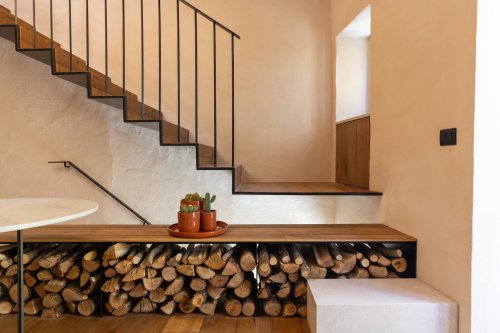 A Floating Iron Stair Cuts Through a Bladesmith’s Workshop Turned Residence in Italy