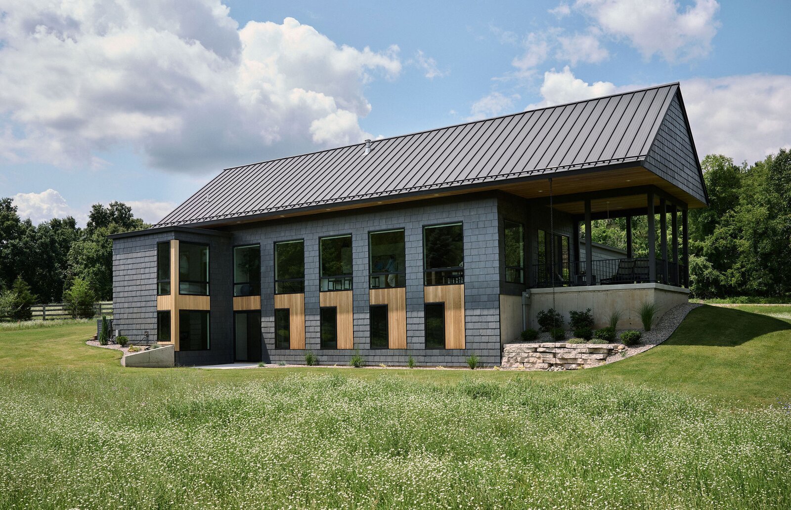 Behind This Home’s Private Facade Is an Expansive Wall of Windows