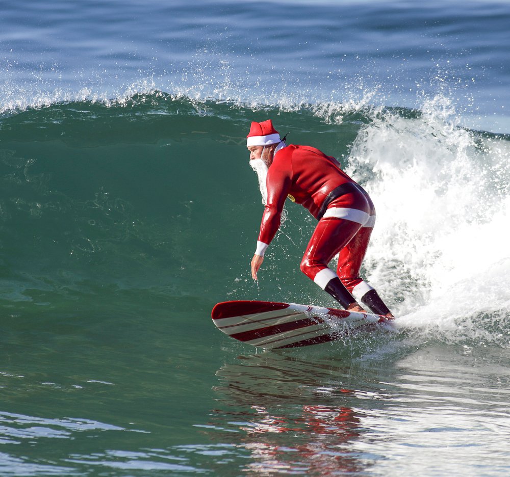 Surfing Santa brings smiles with surf to the beach cities
