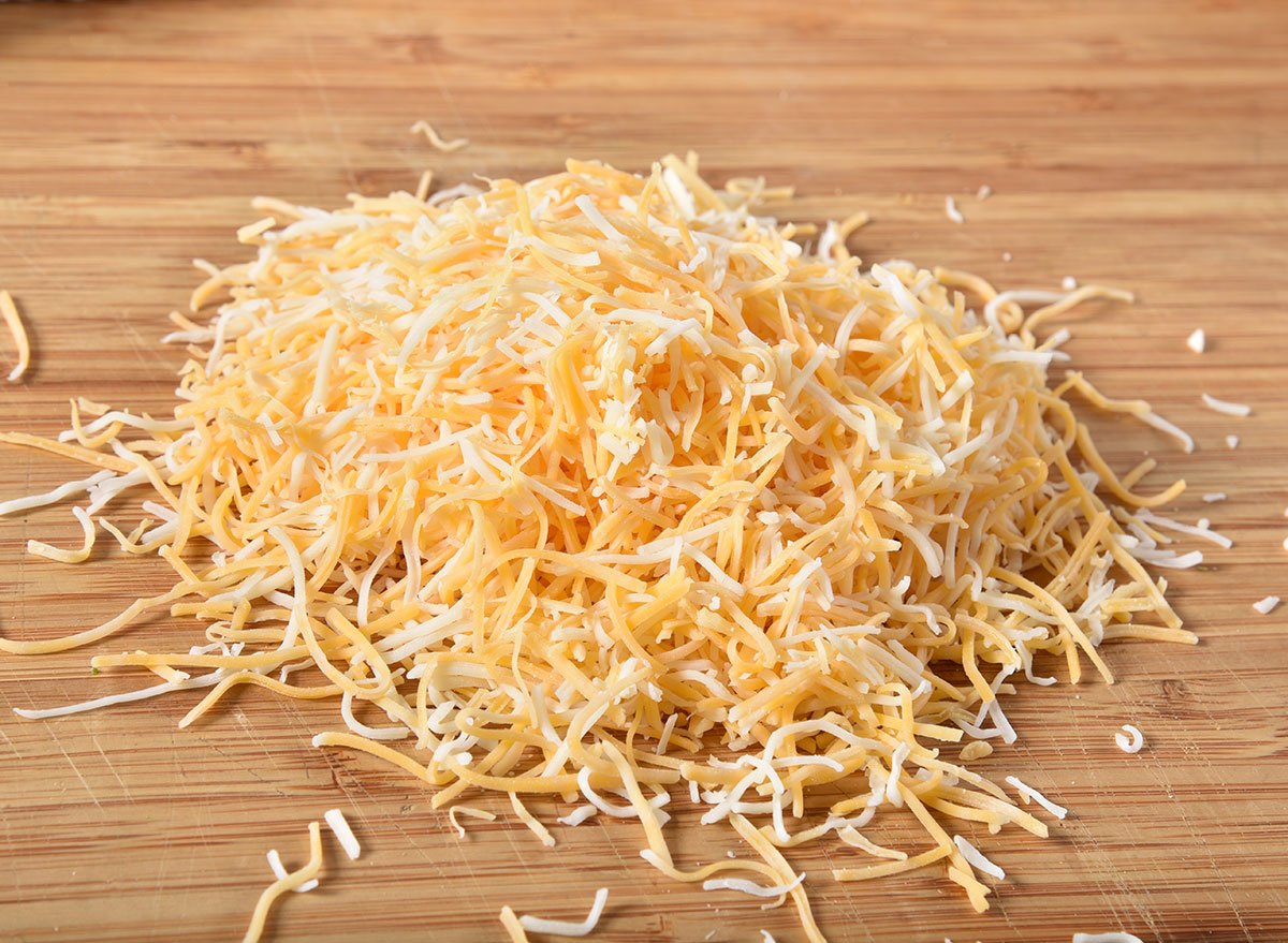 The Hidden Ingredient In Shredded Cheese That's Destroying Your Recipes