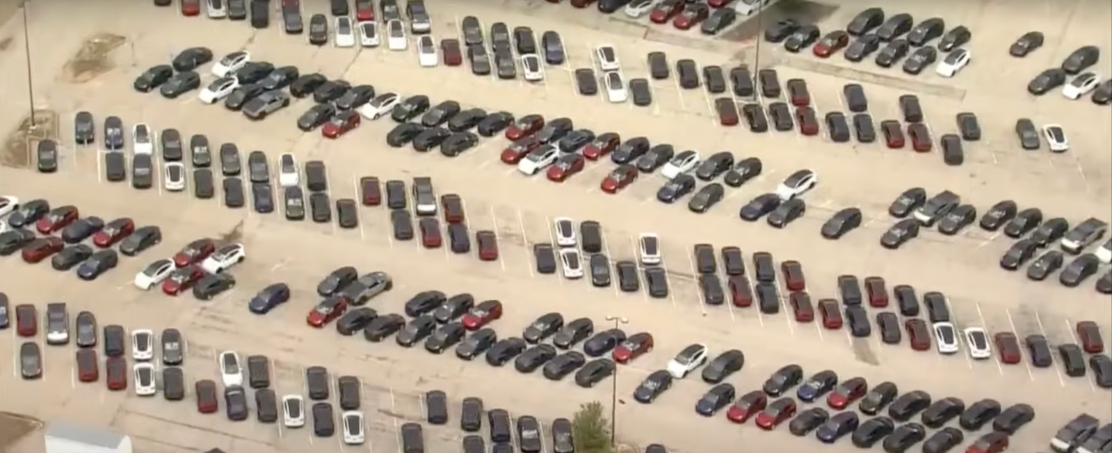 Tesla (TSLA) is sitting on so much inventory it has to take over parking lots all over the US