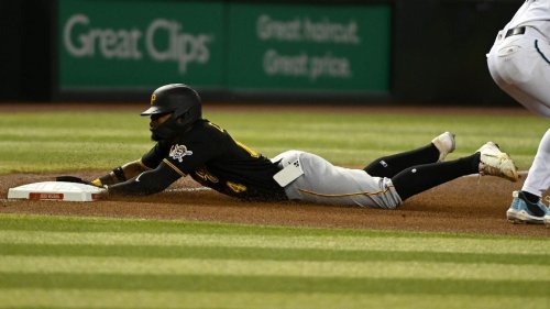 Phone flies out of Pirates 2B's pocket during slide