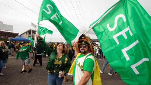 A's fans protest move by watching opener in parking lot