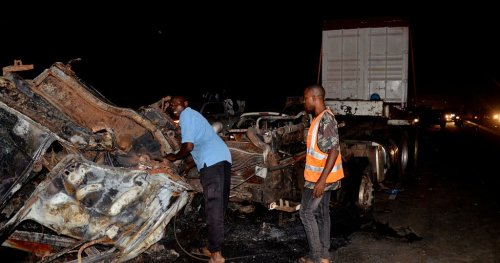 At least 8 killed after a trailer crashed into vehicles and burst into flame