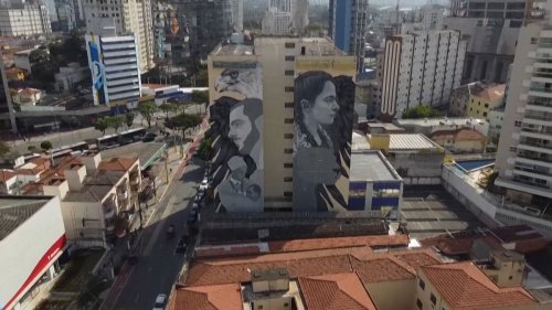 Video. Graffiti artists paint giant murals on tower blocks in Sao Paulo