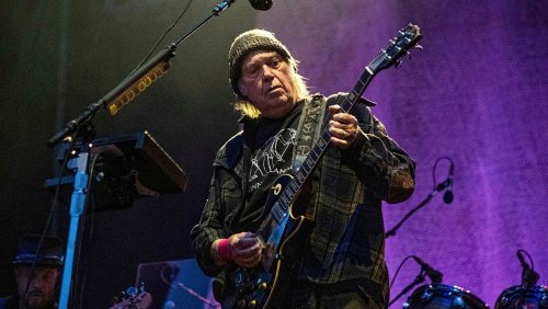 Spotify grants Neil Young's request to remove music in conspiracy theory row
