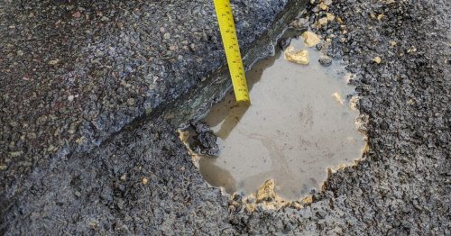 Huddersfield driver rings 999 after smashing into deep danger pothole