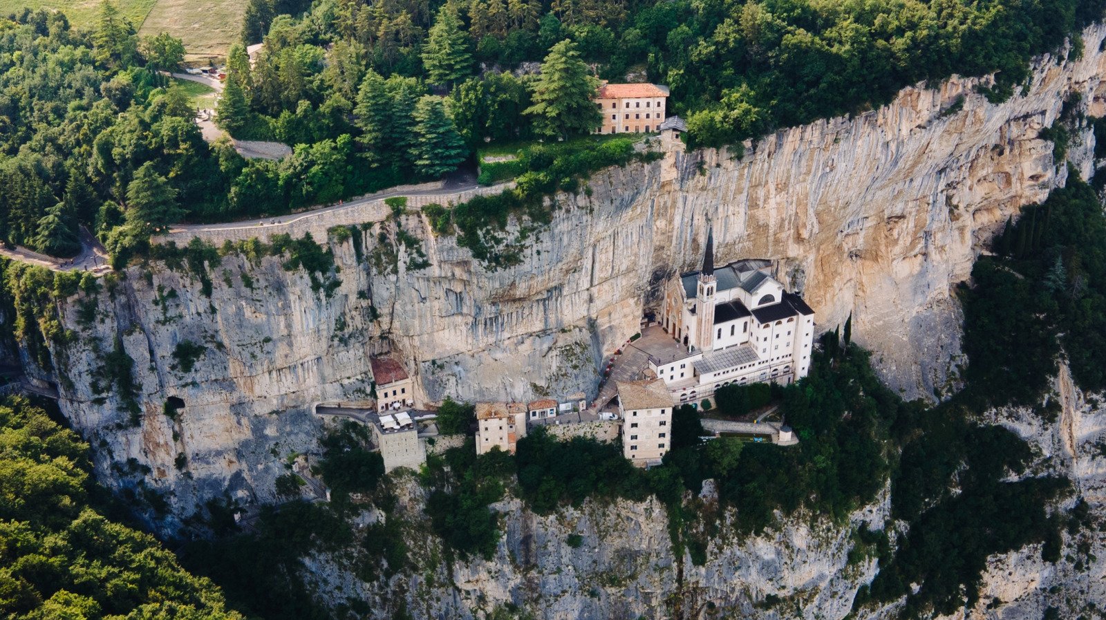 This Attraction In Italy Is A Cliffside Sanctuary That Seems To Defy Physics - cover