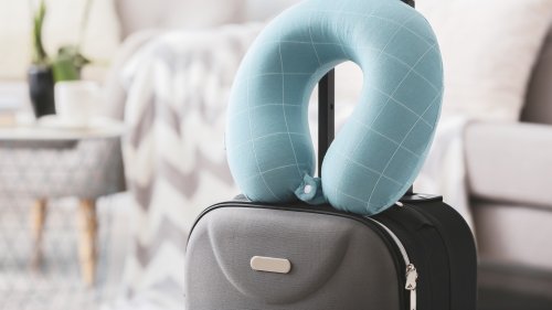This Sweater Hack Proves You Don't Need To Buy A Travel Pillow To Sleep Well On A Plane