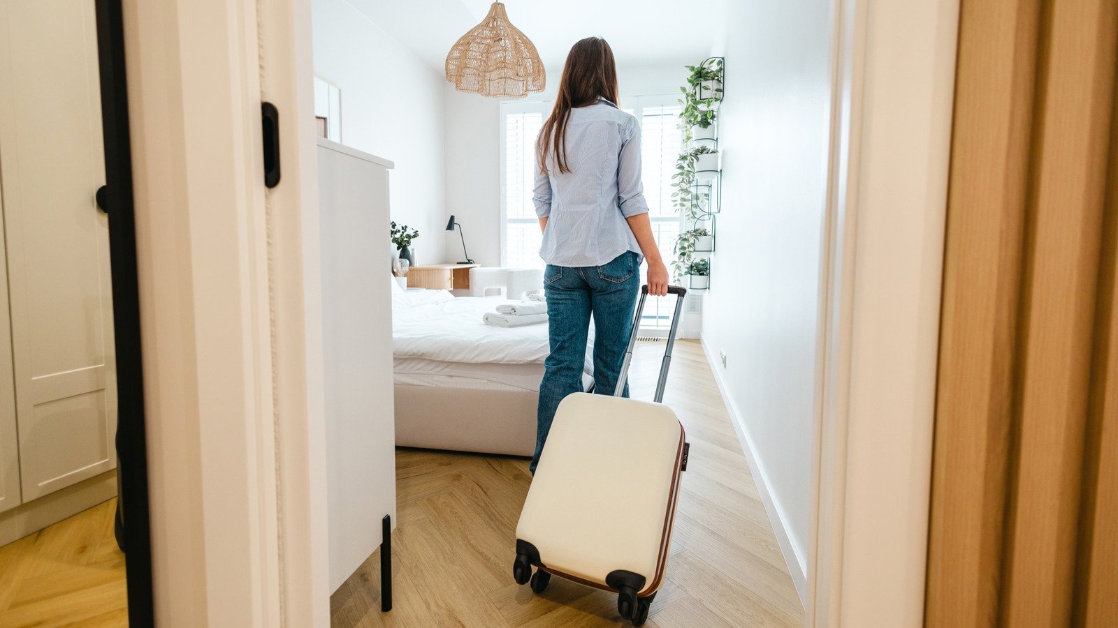 The Unexpected Spot You Should Store Luggage In Hotel Rooms - cover
