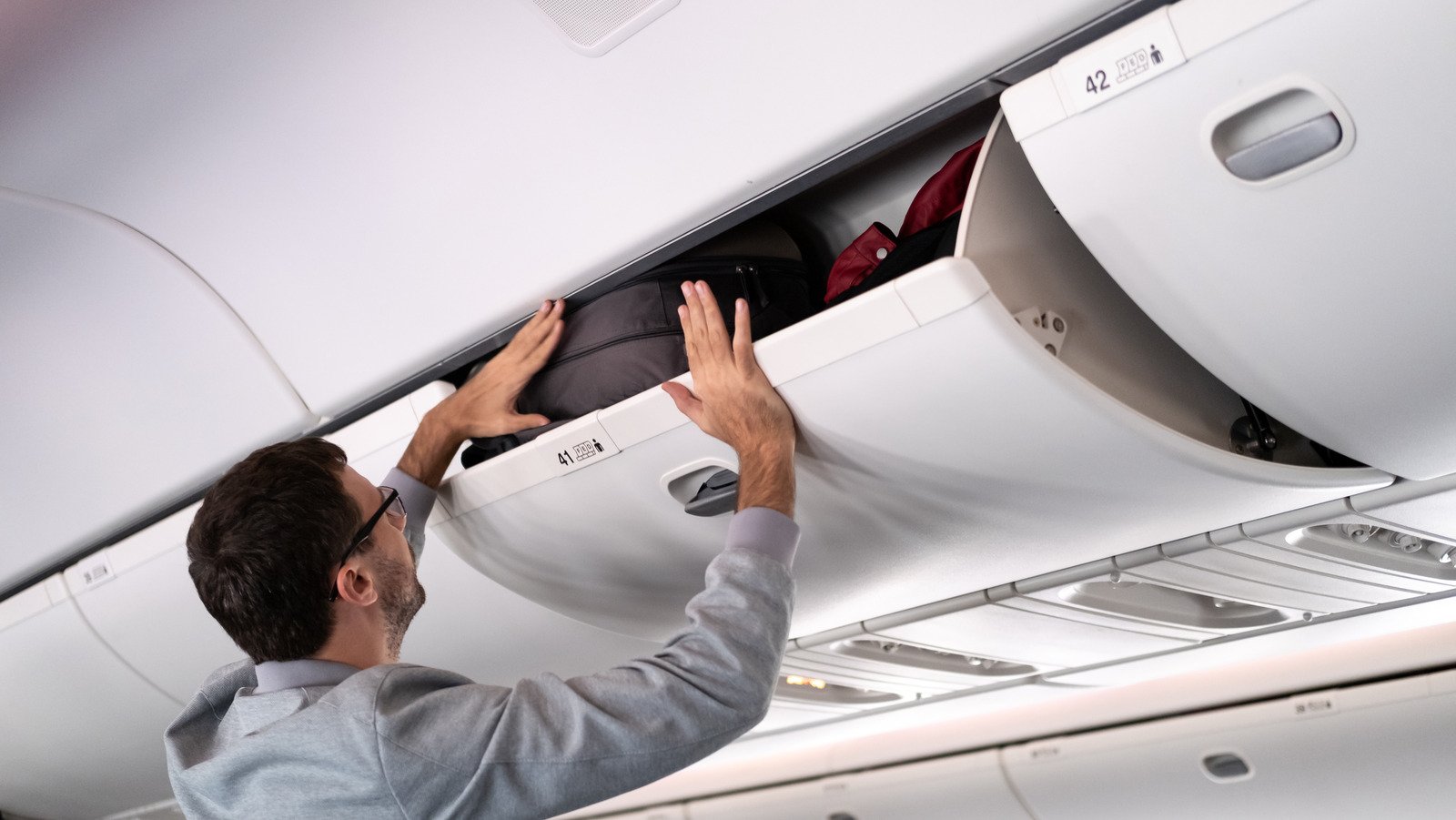 Flight Attendants Can't Stand This Overhead Bin Mistake