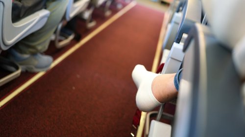 A Clever Hiking Gear Hack Keeps Your Feet Comfy On An Airplane Without Going Shoeless