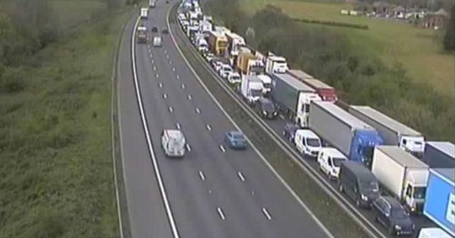 Major UK motorway gridlocked as drivers queue forfour miles after crash