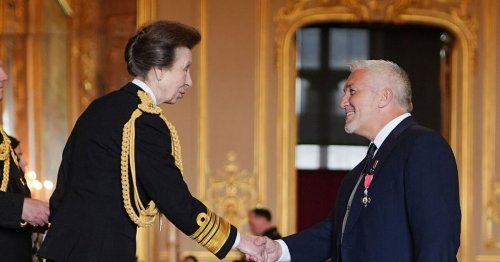 GBBO's Paul Hollywood shares a joke with Princess Anne as he's awarded MBE
