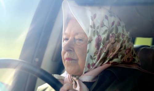 Queen cuts lonely figure as she's spotted driving to take loved dogs for walk on birthday