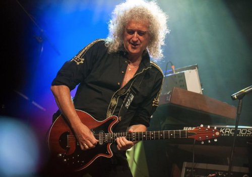 Why Brian May uses a coin to play the guitar