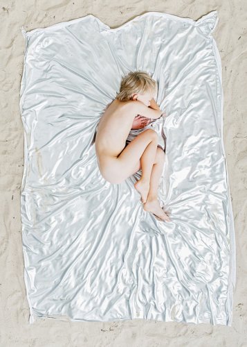 Asleep in the Sun: Portraits of Slumbering Sunbathers