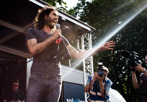 Russell Brand’s Demonetization Is Not a Bug of the Emerging Financial Order, but a Feature