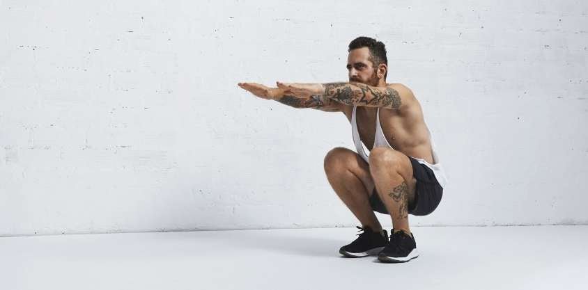 Proper Squat Form: 7 Keys to a Perfect Squat, Say Exercise Experts