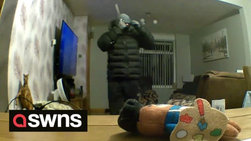 Chilling video captures a knifeman wandering into family’s living room as they slept downstairs
