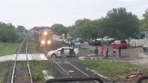 Mexico: Car stuck on railway tracks is hit by cargo train