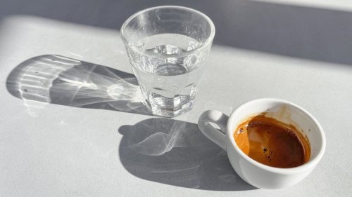 The Reason European Cafes Serve Shots Of Water With Their Coffee