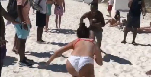 Man's violent beach tackle on woman in bikini is breaking the Internet