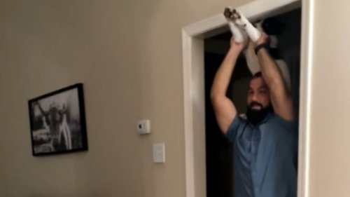 Puppy loves to get bumpy rides on Dad's shoulders like it is superman *Hilarious*