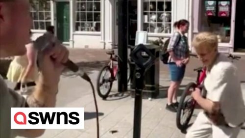 Elderly woman goes viral after showing off dance moves on high street with busker