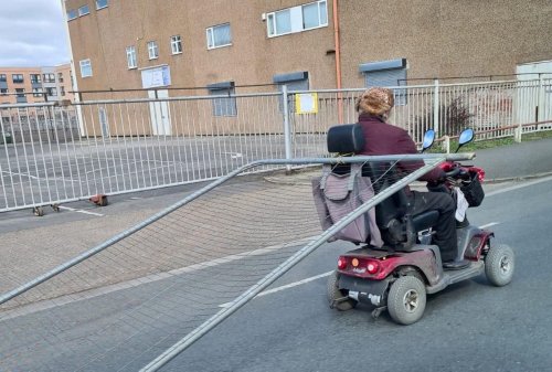 Bizarre moment OAP on mobility scooter drags fence down busy road in Grimsby