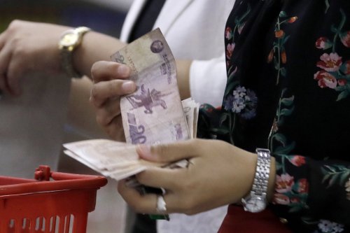 'Dollarization' of North Korean economy, once vital, now potential threat to Kim's rule