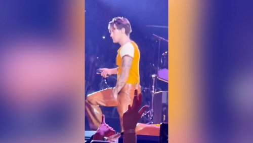 Harry Styles suffers wardrobe malfunction during concert - as Jennifer Aniston looks on
