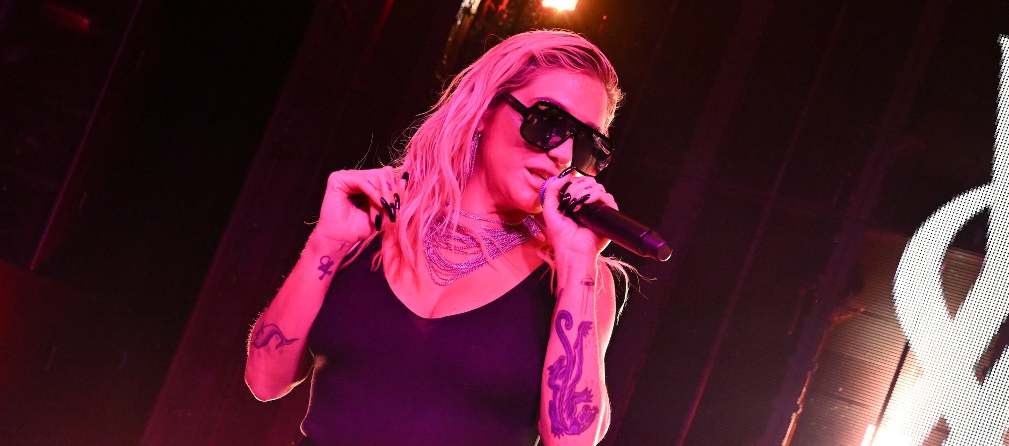 WATCH: Kesha's on-stage champagne toss goes wrong, photographer gets hit