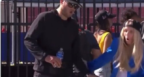 Matthew Stafford walks away after woman falls off the stage at Super Bowl parade