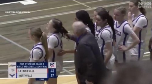 WATCH: High school basketball coach yanks player's hair after loss