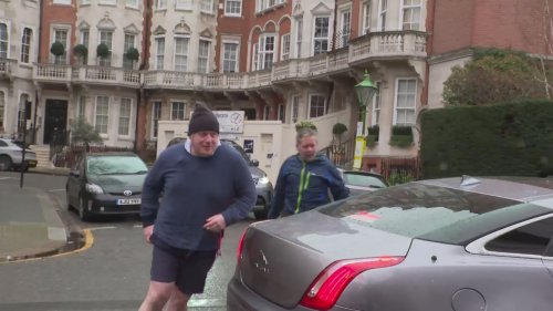 Boris Johnson dashes inside at central London residence