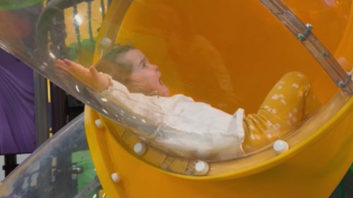 Frightened toddler cries after thinking she's stuck in the slide *Hilarious*